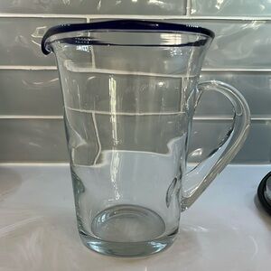 Glass pitcher with navy rim